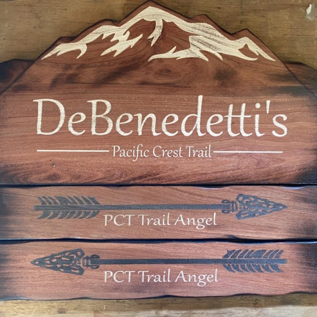 Hand-carved wooden DeBenedetti's Pacific Crest Trail signs